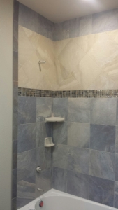 R&R Homes 4349 Yarrow Lane main bath shower walls - DalTile Ayers Rock porcelain tile with custom design.