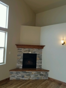 4349 Yarrow Lane fireplace with DalTile stone and wood hearth and mantle